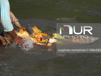 Nepali Hindu devotees immerse the eco-friendly idol of Lord Bishwokarma in the Bagmati River in Kathmandu, Nepal, on September 18, 2024. Bis...