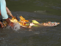 Nepali Hindu devotees immerse the eco-friendly idol of Lord Bishwokarma in the Bagmati River in Kathmandu, Nepal, on September 18, 2024. Bis...