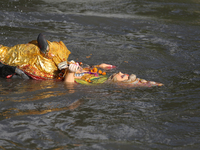 Nepali Hindu devotees immerse the eco-friendly idol of Lord Bishwokarma in the Bagmati River in Kathmandu, Nepal, on September 18, 2024. Bis...