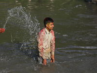 Nepali Hindu devotees immerse the eco-friendly idol of Lord Bishwokarma in the Bagmati River in Kathmandu, Nepal, on September 18, 2024. Bis...