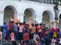 Nepali Hindu devotees carry an eco-friendly idol of Lord Bishwokarma to immerse it in the Bagmati River in Kathmandu, Nepal, on September 18...