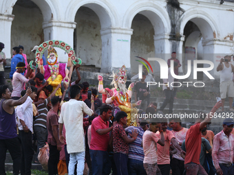 Nepali Hindu devotees carry an eco-friendly idol of Lord Bishwokarma to immerse it in the Bagmati River in Kathmandu, Nepal, on September 18...