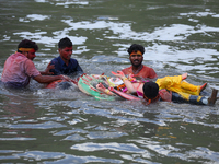 Nepali Hindu devotees immerse the eco-friendly idol of Lord Bishwokarma in the Bagmati River in Kathmandu, Nepal, on September 18, 2024. Bis...