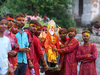 Nepali Hindu devotees carry an eco-friendly idol of Lord Bishwokarma to immerse it in the Bagmati River in Kathmandu, Nepal, on September 18...