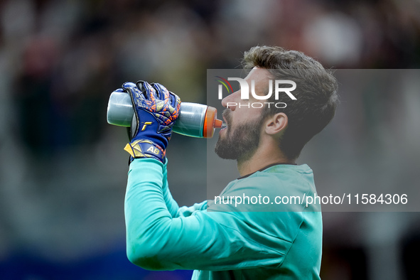 Alisson Becker of Liverpool FC during the UEFA Champions League 2024/25 League Phase MD1 match between AC Milan and Liverpool FC at Stadio S...