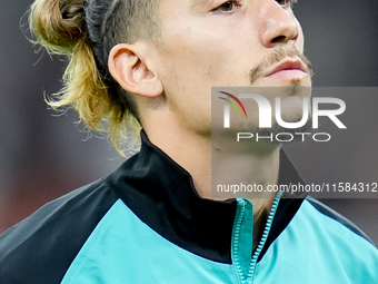 Kostas Tsimikas of Liverpool FC looks on during the UEFA Champions League 2024/25 League Phase MD1 match between AC Milan and Liverpool FC a...