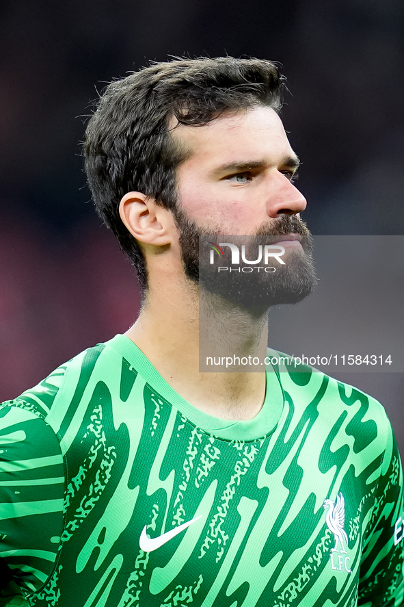 Alisson Becker of Liverpool FC looks on during the UEFA Champions League 2024/25 League Phase MD1 match between AC Milan and Liverpool FC at...