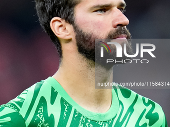 Alisson Becker of Liverpool FC looks on during the UEFA Champions League 2024/25 League Phase MD1 match between AC Milan and Liverpool FC at...