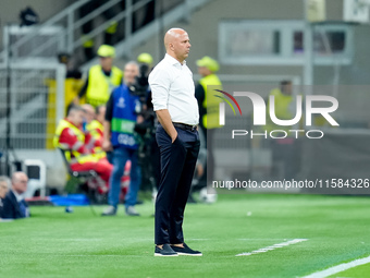 Arne Slot head coach of Liverpool FC looks on during the UEFA Champions League 2024/25 League Phase MD1 match between AC Milan and Liverpool...