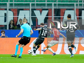 Christian Pulisic of AC Milan scores first goal during the UEFA Champions League 2024/25 League Phase MD1 match between AC Milan and Liverpo...