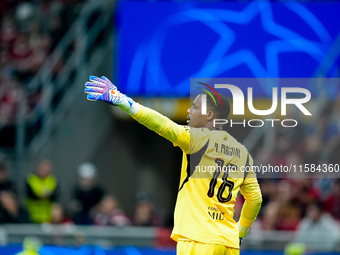 Mike Maignan of AC Milan gestures during the UEFA Champions League 2024/25 League Phase MD1 match between AC Milan and Liverpool FC at Stadi...