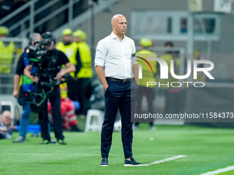 Arne Slot head coach of Liverpool FC looks on during the UEFA Champions League 2024/25 League Phase MD1 match between AC Milan and Liverpool...