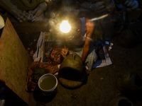 An artist makes the head of an idol ahead of the Durga Puja festival at a potters' hub in Kolkata, India, on September 18, 2024. (