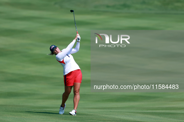 GAINESVILLE, VIRGINIA - SEPTEMBER 15: Lauren Coughlin of the United States hits from the 12th fairway during the final round of the Solheim...