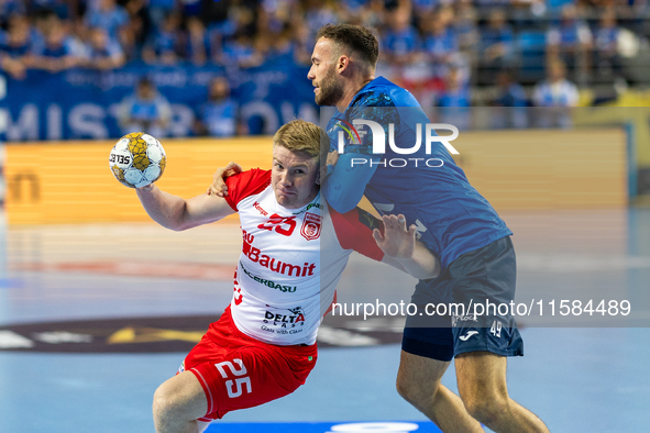 Haukur Thrastarson and Zoltan Szita are playing  during the match EHF Champions League Men match between  Orlen Wisla Plock and Dinamo Bucur...