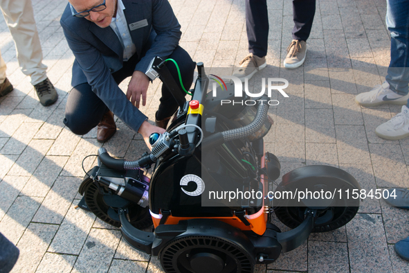 The Butty robot from the Danish robotics company demonstrates cleaning cigarette butts on the opening day of Deutsche Telekom's Digital X ev...