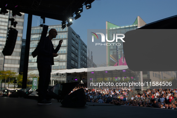 Timotheus Hoettges, CEO of Deutsche Telekom, speaks on the stage at Media Park on the opening day of Deutsche Telekom's Digital X event in C...