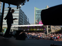 Timotheus Hoettges, CEO of Deutsche Telekom, speaks on the stage at Media Park on the opening day of Deutsche Telekom's Digital X event in C...