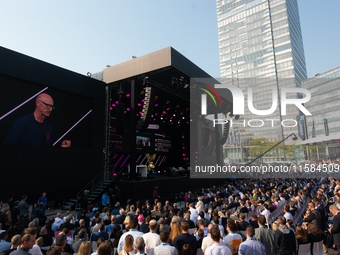 Timotheus Hoettges, CEO of Deutsche Telekom, speaks on the stage at Media Park on the opening day of Deutsche Telekom's Digital X event in C...