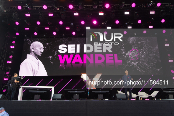 Timotheus Hoettges, CEO of Deutsche Telekom, speaks on the stage at Media Park on the opening day of Deutsche Telekom's Digital X event in C...