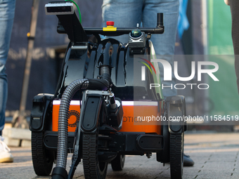 The butty robot from a Danish robotics company demonstrates cleaning cigarette butts on the opening day of Deutsche Telekom's digital X even...