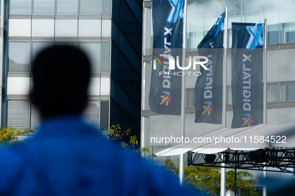 The flags of Digital X are seen on the opening day of Deutsche Telekom's Digital X event at Media Park in Cologne, Germany, on September 18,...