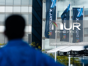 The flags of Digital X are seen on the opening day of Deutsche Telekom's Digital X event at Media Park in Cologne, Germany, on September 18,...