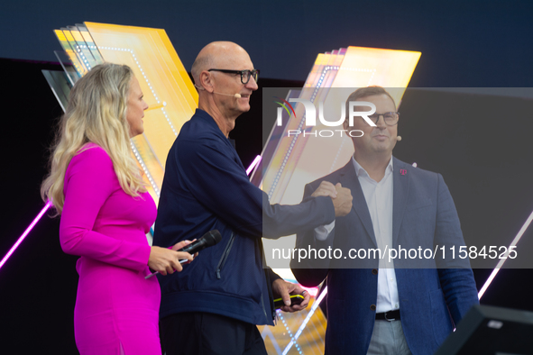 Timotheus Hoettges, CEO of Deutsche Telekom, Barbara Schoneberger, and Klaus Werner, the director of the management team of Deutsche Telekom...