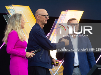 Timotheus Hoettges, CEO of Deutsche Telekom, Barbara Schoneberger, and Klaus Werner, the director of the management team of Deutsche Telekom...