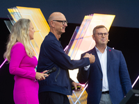 Timotheus Hoettges, CEO of Deutsche Telekom, Barbara Schoneberger, and Klaus Werner, the director of the management team of Deutsche Telekom...