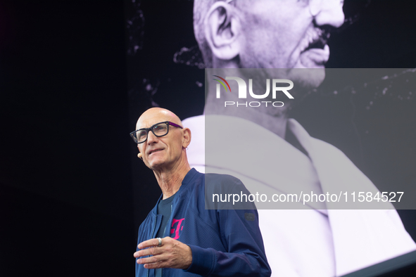 Timotheus Hoettges, CEO of Deutsche Telekom, speaks on the stage at Media Park on the opening day of Deutsche Telekom's Digital X event in C...