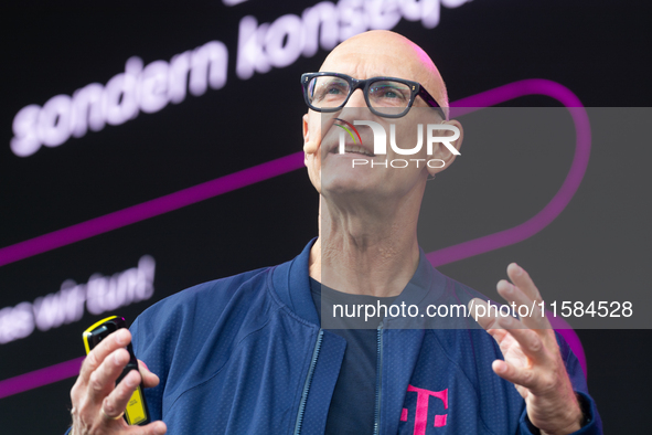 Timotheus Hoettges, CEO of Deutsche Telekom, speaks on the stage at Media Park on the opening day of Deutsche Telekom's Digital X event in C...