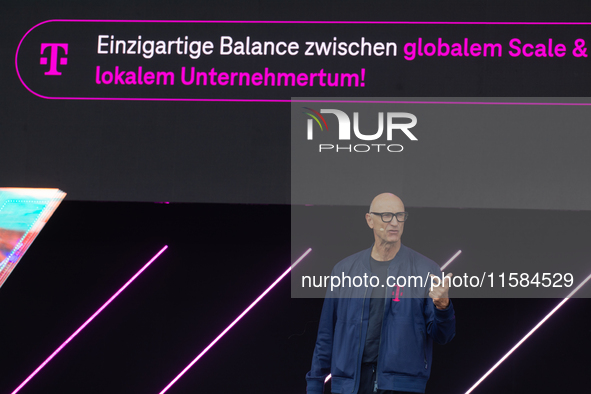 Timotheus Hoettges, CEO of Deutsche Telekom, speaks on the stage at Media Park on the opening day of Deutsche Telekom's Digital X event in C...