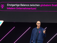 Timotheus Hoettges, CEO of Deutsche Telekom, speaks on the stage at Media Park on the opening day of Deutsche Telekom's Digital X event in C...