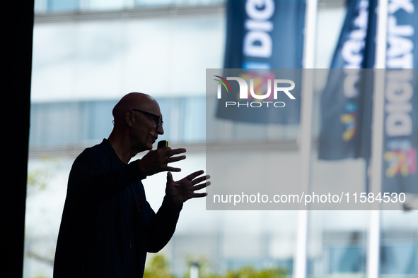 Timotheus Hoettges, CEO of Deutsche Telekom, speaks on the stage at Media Park on the opening day of Deutsche Telekom's Digital X event in C...