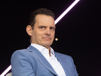 Leonhard Birnbaum, Chief Executive Officer of E.ON SE, stands on the stage at Media Park on the opening day of Deutsche Telekom's Digital X...