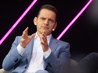 Leonhard Birnbaum, Chief Executive Officer of E.ON SE, stands on the stage at Media Park on the opening day of Deutsche Telekom's Digital X...