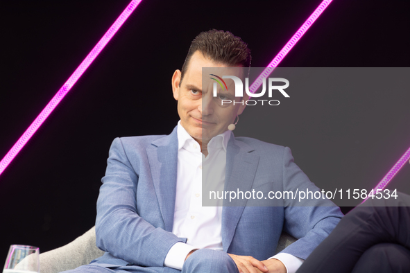 Leonhard Birnbaum, Chief Executive Officer of E.ON SE, stands on the stage at Media Park on the opening day of Deutsche Telekom's Digital X...