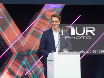 Hendrik Wust, Prime Minister of North Rhine-Westphalia, speaks on the stage at Media Park on the opening day of Deutsche Telekom's Digital X...