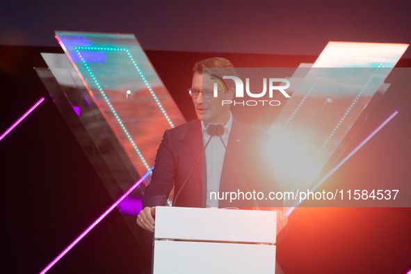 Hendrik Wust, Prime Minister of North Rhine-Westphalia, speaks on the stage at Media Park on the opening day of Deutsche Telekom's Digital X...