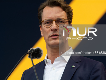 Hendrik Wust, Prime Minister of North Rhine-Westphalia, speaks on the stage at Media Park on the opening day of Deutsche Telekom's Digital X...