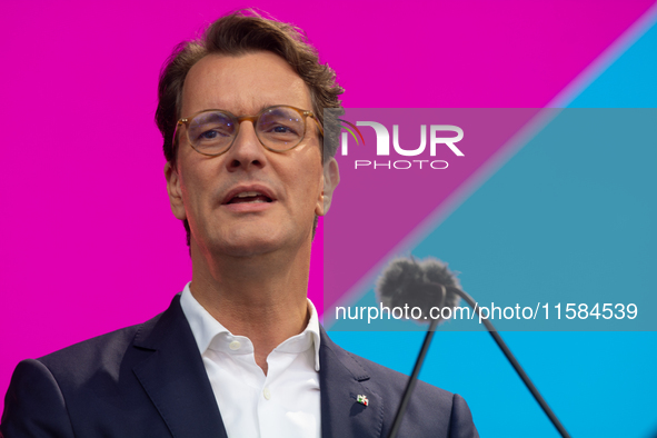 Hendrik Wust, Prime Minister of North Rhine-Westphalia, speaks on the stage at Media Park on the opening day of Deutsche Telekom's Digital X...