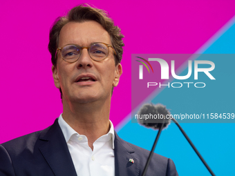 Hendrik Wust, Prime Minister of North Rhine-Westphalia, speaks on the stage at Media Park on the opening day of Deutsche Telekom's Digital X...