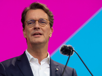 Hendrik Wust, Prime Minister of North Rhine-Westphalia, speaks on the stage at Media Park on the opening day of Deutsche Telekom's Digital X...