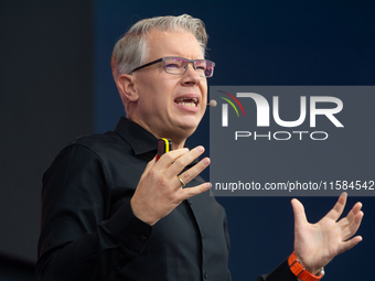 Frank Thelen, German entrepreneur, speaks on the stage at Media Park on the opening day of Deutsche Telekom's Digital X event in Cologne, Ge...