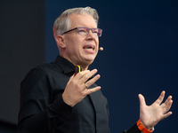 Frank Thelen, German entrepreneur, speaks on the stage at Media Park on the opening day of Deutsche Telekom's Digital X event in Cologne, Ge...