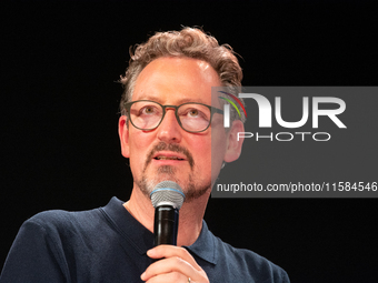 Dr. Eckart von Hirschhausen speaks on the opening day of Deutsche Telekom's digital X event at Media Park in Cologne, Germany, on September...