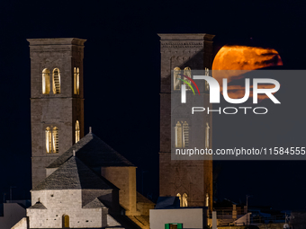 The September Supermoon, also called the Full Harvest Moon, rises between the towers of Molfetta Cathedral in Molfetta, Italy, on September...