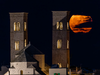 The September Supermoon, also called the Full Harvest Moon, rises between the towers of Molfetta Cathedral in Molfetta, Italy, on September...