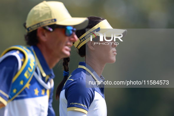 GAINESVILLE, VIRGINIA - SEPTEMBER 15: Celine Boutier of Team Europe walks with ther caddie on the 12th fairway during the final round of the...